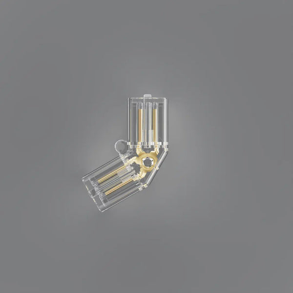 A transparent plastic electrical connector with gold-colored internal metal contacts, shown against a solid gray background.