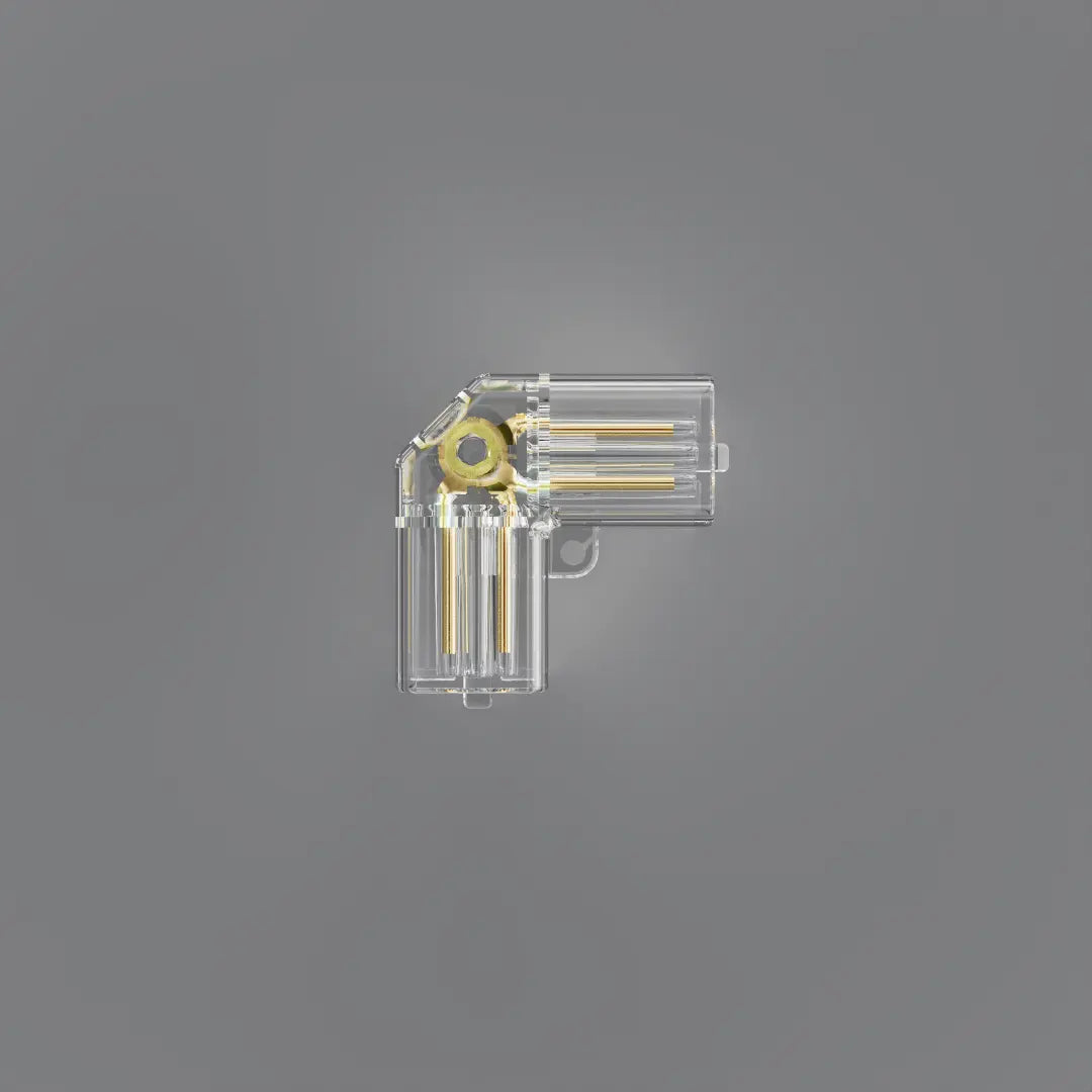 A clear plastic L-shaped electronic component with gold-colored internal contacts, shown on a solid gray background.